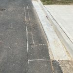 Before Image of Asphalt Patch Repairs & Layback Gutter Edge Repairs in Padstow Heights, NSW