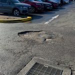 Before Image of Asphalt Carpark Repair at Carnes Hill Marketplace, NSW